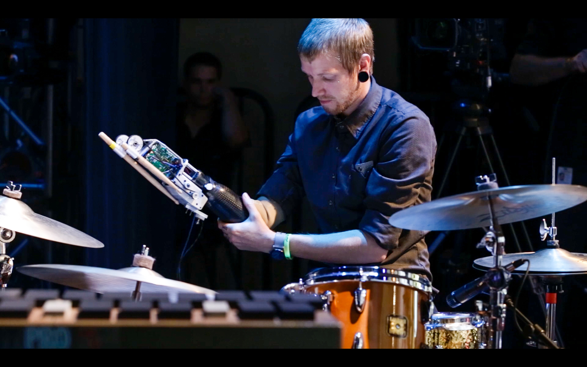 Jason Barnes drumming with his dual-stick robotic prosthetic